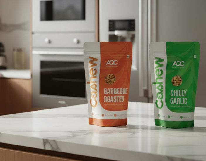 Three packages of Cashew AC on a white surface with an orange background